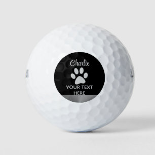 Silver Dog Paw auf schwarzem Hintergrund Golfball