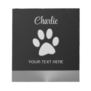 Silver Dog Paw auf schwarzem Hintergrund Notizblock