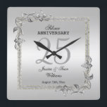 Silver Gem & Glitter 25th Wedding Anniversary Quadratische Wanduhr<br><div class="desc">Glamorous and elegant posh 25th Silver Wedding Anniversary wall clock with stylish silver gem stone jewels corner decorations and matching colored glitter border frame. A romantic design for your celebration. All text, font and font color is fully customizable to meet your requirements. If you would like help to customize your...</div>