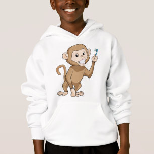 Singe avec brosse à dents