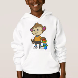 Singe comme patineur avec skateboard