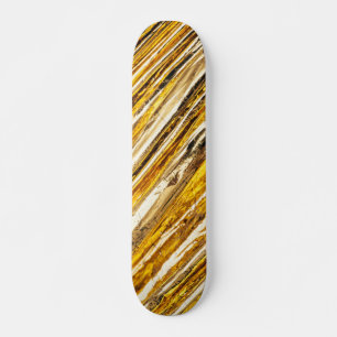 Skateboard Fonte d'or chatoyante en chute