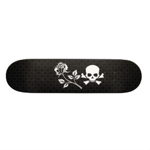 Skateboard S'est levé et le crâne sur le noir