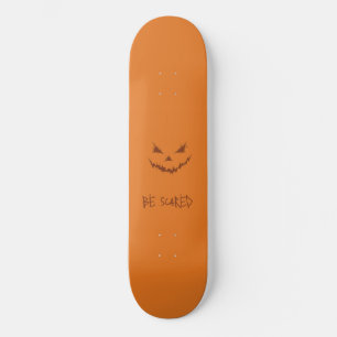 Skateboard Visage de Citrouille sculpté orange et effrayant