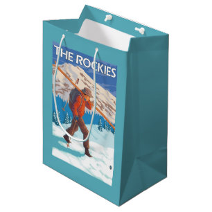 Skifahrer-tragende Schnee-Skis - die Rockies Mittlere Geschenktüte