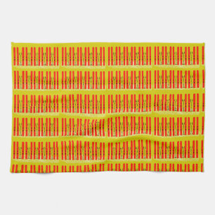 Skis rouges sur serviette de cuisine jaune