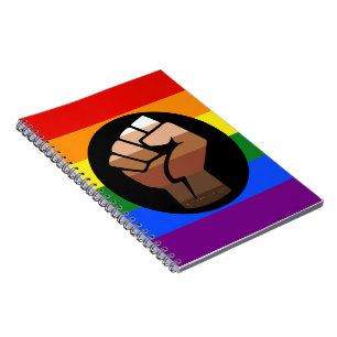 SlipperyJoes Regenbogenflagge mit erhobener Faust Notizblock
