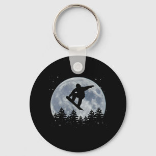 Snowboarden springt vor dem Mond Schlüsselanhänger