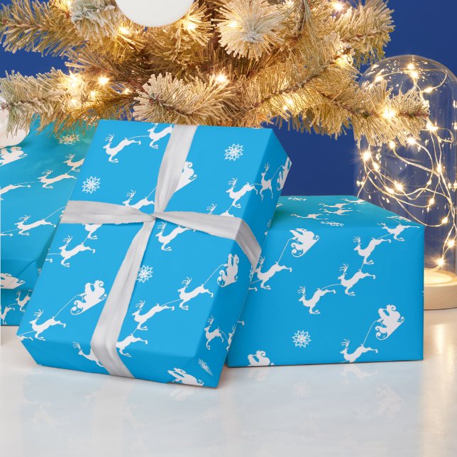 Snowflake und Santa mit Schlitten auf dem BLAU Geschenkpapier (Feiertage)