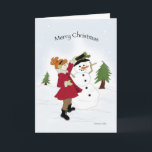 Snowman and Little Girl Christmas Card Feiertagskarte<br><div class="desc">Kleines Mädchen in einem kräftig roten Mantel,  das einen schwarzen Hut auf einen Schneemann legt.</div>