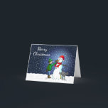 Snowman Gebäude Feiertagskarte<br><div class="desc">Der Junge hat einen Schneemann gebaut,  auf dem sein Hund steht und uriniert,  während der Junge dem Schneemann eine Karottennaase gibt.</div>