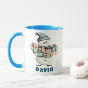Snowman Holding Weihnachten präsentiert Blue Hat Tasse