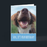 Son Birthday, Happy Dog mit Big Smile Karte<br><div class="desc">Ein Geburtstag zu feiern ist etwas,  worüber man lächeln kann,  und dieser glückliche Hund wird Ihrem Sohn ein großes Lächeln ins Gesicht bringen. Dieses bezaubernde,  sorgenfreie Jungtier ist ein brauner und weißer Spaniel,  der vor dem Unterschlupf gerettet wurde. Sie genießt jetzt grünes Gras,  blauen Himmel und viele glückliche Geburtstage.</div>