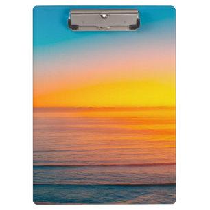 Sonnenaufgang am Strand Klemmbrett