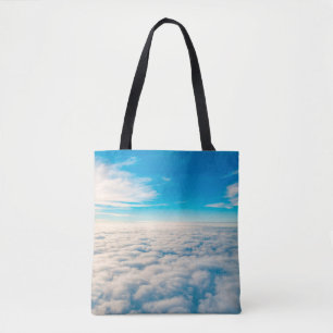 Sonnenaufgang über Wolken aus dem Flugzeugfenster Tasche