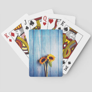Sonnenblume an der blauen Holzwand Spielkarten