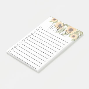 Sonnenblumen und Blätter, die auf der Liste oder d Post-it Klebezettel