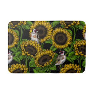 Sonnenblumen und Goldflossen auf schwarz Badematte