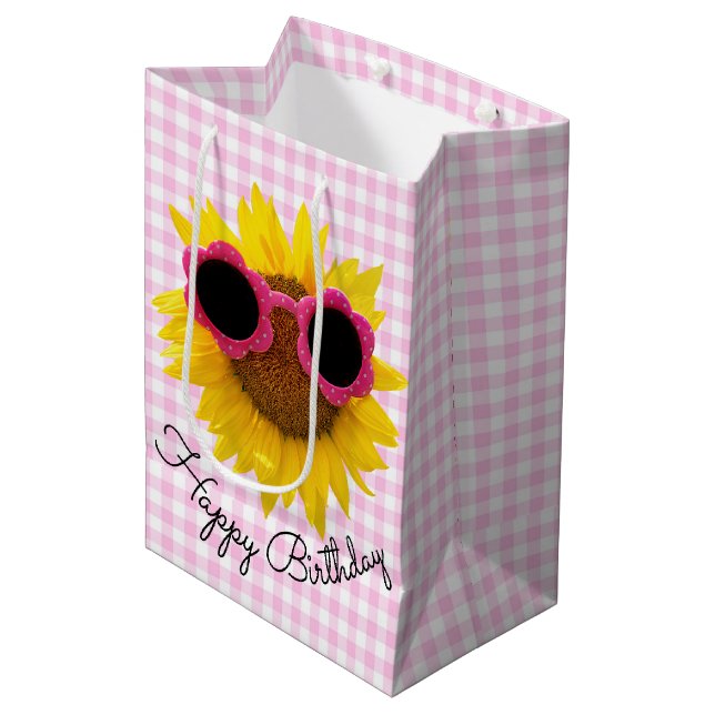 Sonnenbrille auf Sonnenblumen Mittlere Geschenktüte (Vorderseite Schrägansicht)