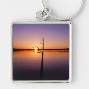 Sonnenuntergang auf einem See, der durch eine Ange Schlüsselanhänger
