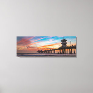 Sonnenuntergang durch Huntington Beach Pier in Kal Leinwanddruck