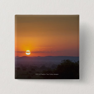 Sonnenuntergang über der afrikanischen Landschaft Button
