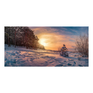 Sonnenuntergang über der schneebedeckten Wintermee Fotodruck