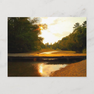 Sonnenuntergang über einer Wasserbrücke Postkarte