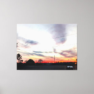 Sonnenuntergang über ländlicher Landschaft Leinwanddruck