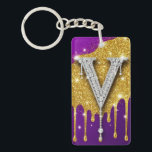 Sparkling Letter V With Gold Glitter Drip Schlüsselanhänger<br><div class="desc">Sparkling diamond-encrusted letter V set against a gold glitter field with dripping metallic effect and vivid purple background,  evoking luxury,  glam monogram style,  celebration and high-fashion bling.</div>