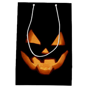 Spaßiger leuchtender Jack O'Lantern geschnitztes H Mittlere Geschenktüte