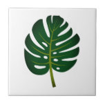 Spezielle Keramik Monstera Fliese<br><div class="desc">Grüne Monstera Palmenblatt Keramik Tile. Trendige Fliesen für Zuhause-Dekorationen wie Bad oder Küchenwand. Fügen Sie optional Ihren eigenen personalisierten Text oder Bild hinzu. Weißer oder benutzerdefinierter Farbhintergrund Erhältlich in großen und kleinen Größen. Das Design ist tropisch, ideal für einen Strandbesuch im Zuhause.</div>