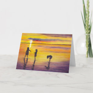 Spielen im Sonnenuntergang Feiertagskarte