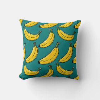 Spielerisches Bananenmuster auf Aquamarinem Kissen