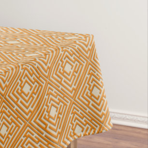 Spielerisches orange Labyrinth auf irgendeiner Tischdecke