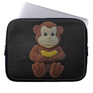 Spielzeug-Affe mit einer Bananen-Laptop-Hülse Laptopschutzhülle
