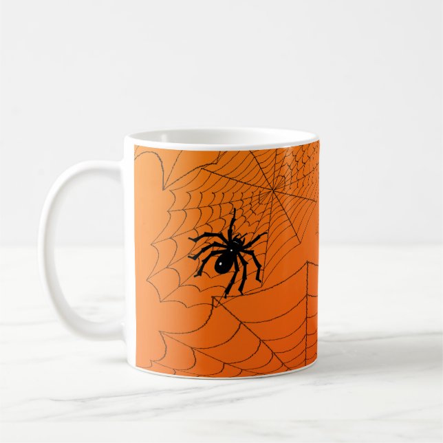 Spinnennetz auf Orange Kaffeetasse (Links)