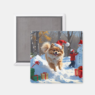 Spitz läuft im Schnee mit Weihnachtshut Magnet