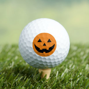 Spookofarbene schwarze Kürbislaterne lustiges Hall Golfball