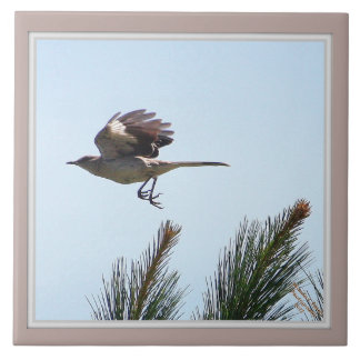 Spottdrossel-im Flug dekorative Fliese