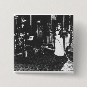 Staubsauger bei der Arbeit Button