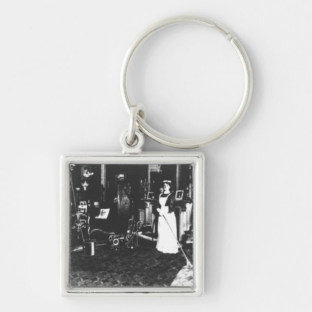 Staubsauger bei der Arbeit Schlüsselanhänger (Vorne)