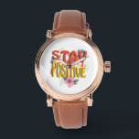 Stay Positive – Floral Motivational  Armbanduhr<br><div class="desc">Brighten your day with this uplifting design! The bold phrase STAY POSITIVE is highlighted with vibrant colors and surrounded by cheerful floral elements,  making it a perfect reminder to embrace optimism and good vibes. Ideal for casual wear,  workouts,  or as a thoughtful gift to inspire positivity.</div>