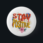 Stay Positive – Floral Motivational Button<br><div class="desc">Brighten your day with this uplifting design! The bold phrase STAY POSITIVE is highlighted with vibrant colors and surrounded by cheerful floral elements, making it a perfect reminder to embrace optimism and good vibes. Ideal for casual wear, workouts, or as a thoughtful gift to inspire positivity.</div>