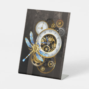 Steampunkuhr mit mechanischem Drachenfliegen Sockelschild