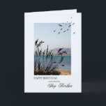 Step BotherBirthday, Seaside Scene Karte<br><div class="desc">Eine schöne Geburtstagskarte für einen Schrittbruder. Eine Szene am Meer mit Silhouette Gras und Möwen. Eine schöne ruhige Umgebung,  um Erinnerungen von Badeferien zu fördern.</div>