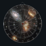 Stephans Quintet: Galaxie-Galaktische Trümmer Dartscheibe<br><div class="desc">Der treffend als "Galaktische Wracks" bezeichnete Hubble offenbart die dramatischen Folgen eines Zusammenpralls zwischen fünf Galaxien. Dieses Bild aus Stephans Quintet zeigt einen chaotischen Tanz verzerrter Formen,  lebendige blaue Sterngeburtsregionen und weise Schwänze von Gas,  das durch die Gravitationsbegegnung aus Galaxien gerissen wurde.</div>