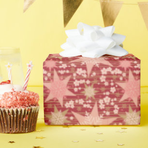 Sterne, die zwischen rosa Kirschblossom gesprenkel Geschenkpapier