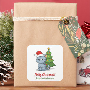 Sticker Carré Chat tabby gris grincheux avec chapeau de Noël rou