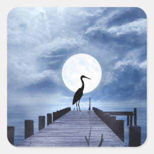 Sticker Carré Heron Silhouette sur la jetée avec la plage de Ple